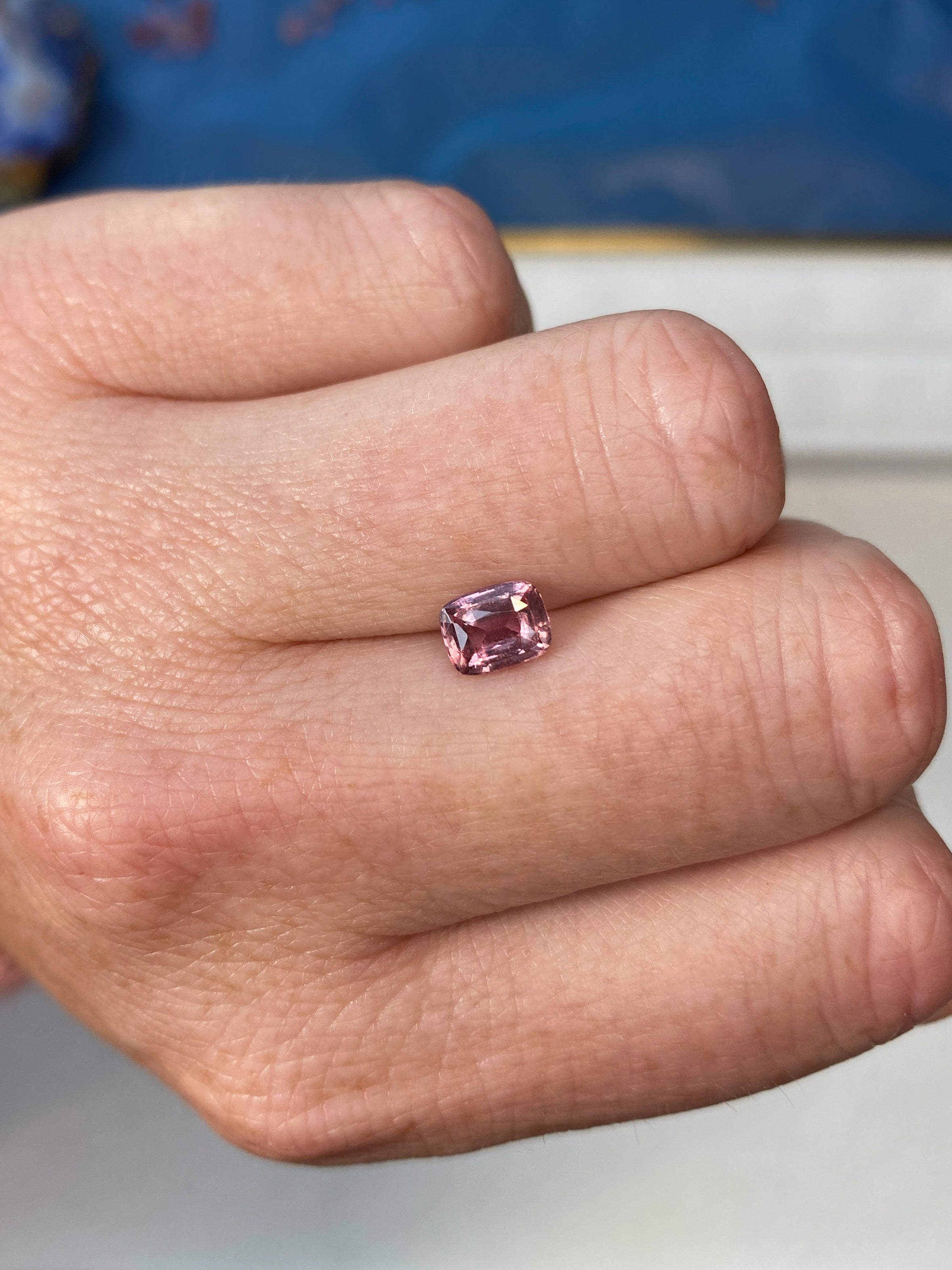 1.24ct Padparadscha Sapphire Cushion Cut Unheated on Hand
