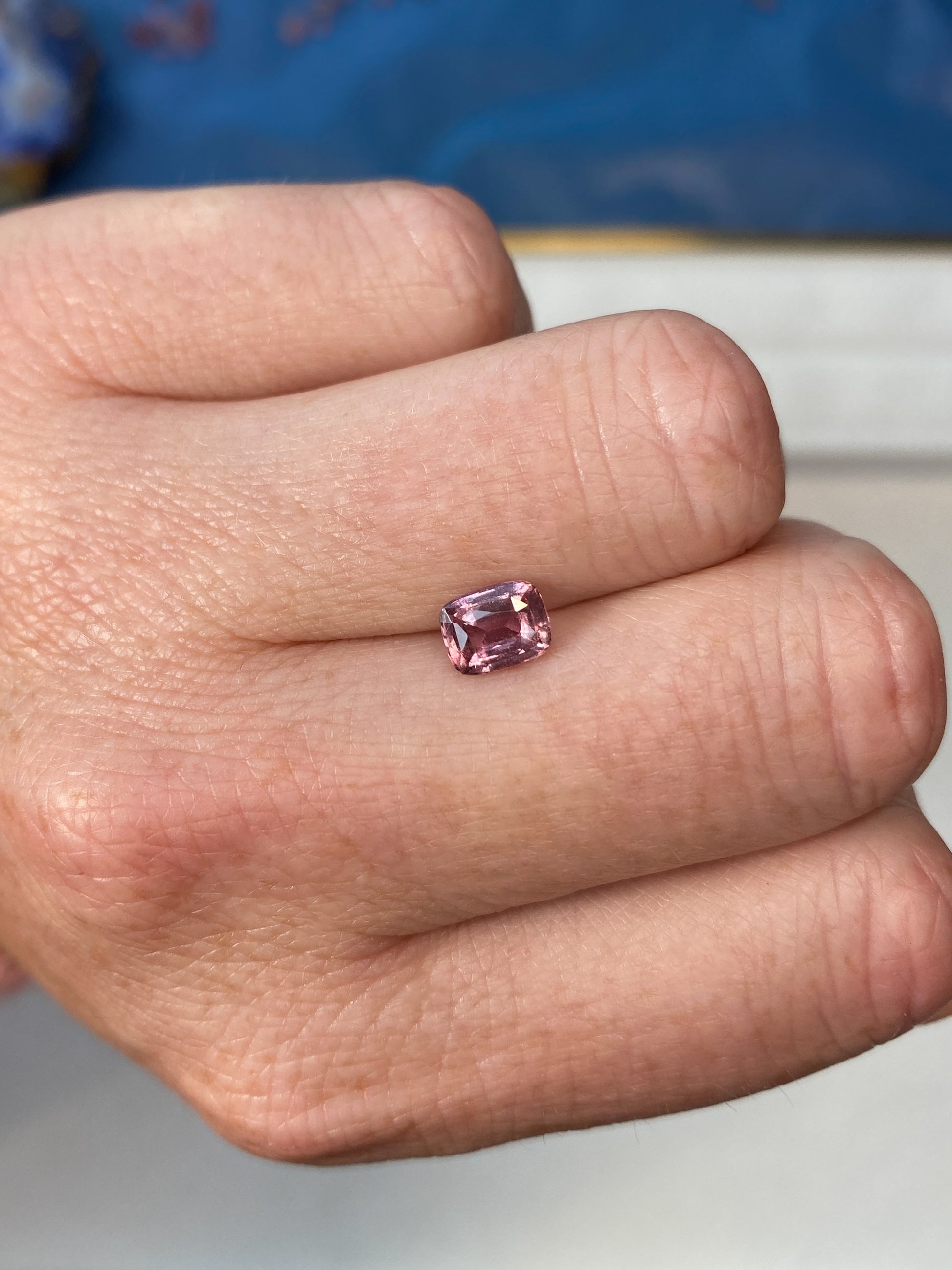 1.24ct Padparadscha Sapphire Cushion Cut Unheated on Hand