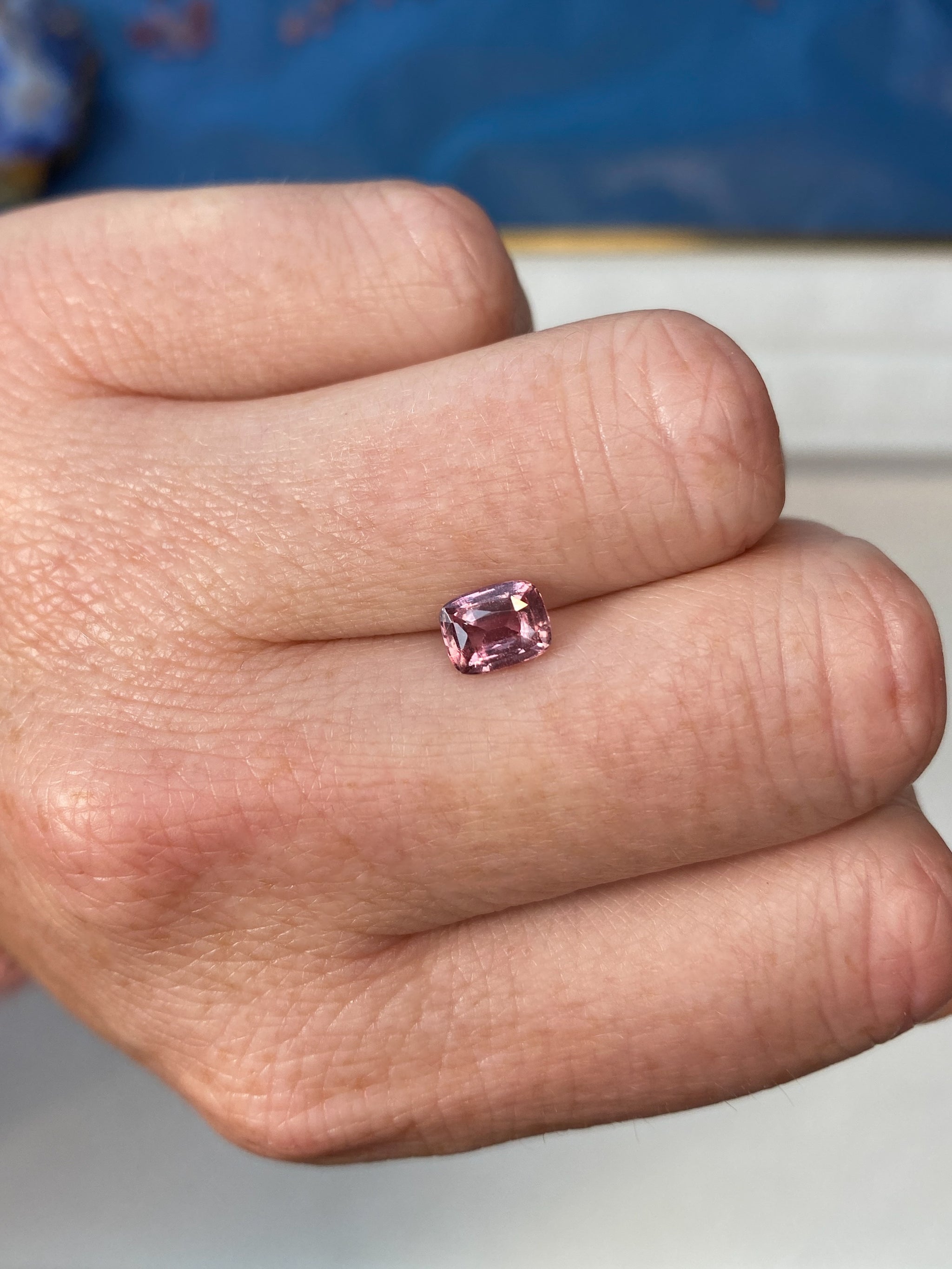 1.24ct Padparadscha Sapphire Cushion Cut Unheated on Hand