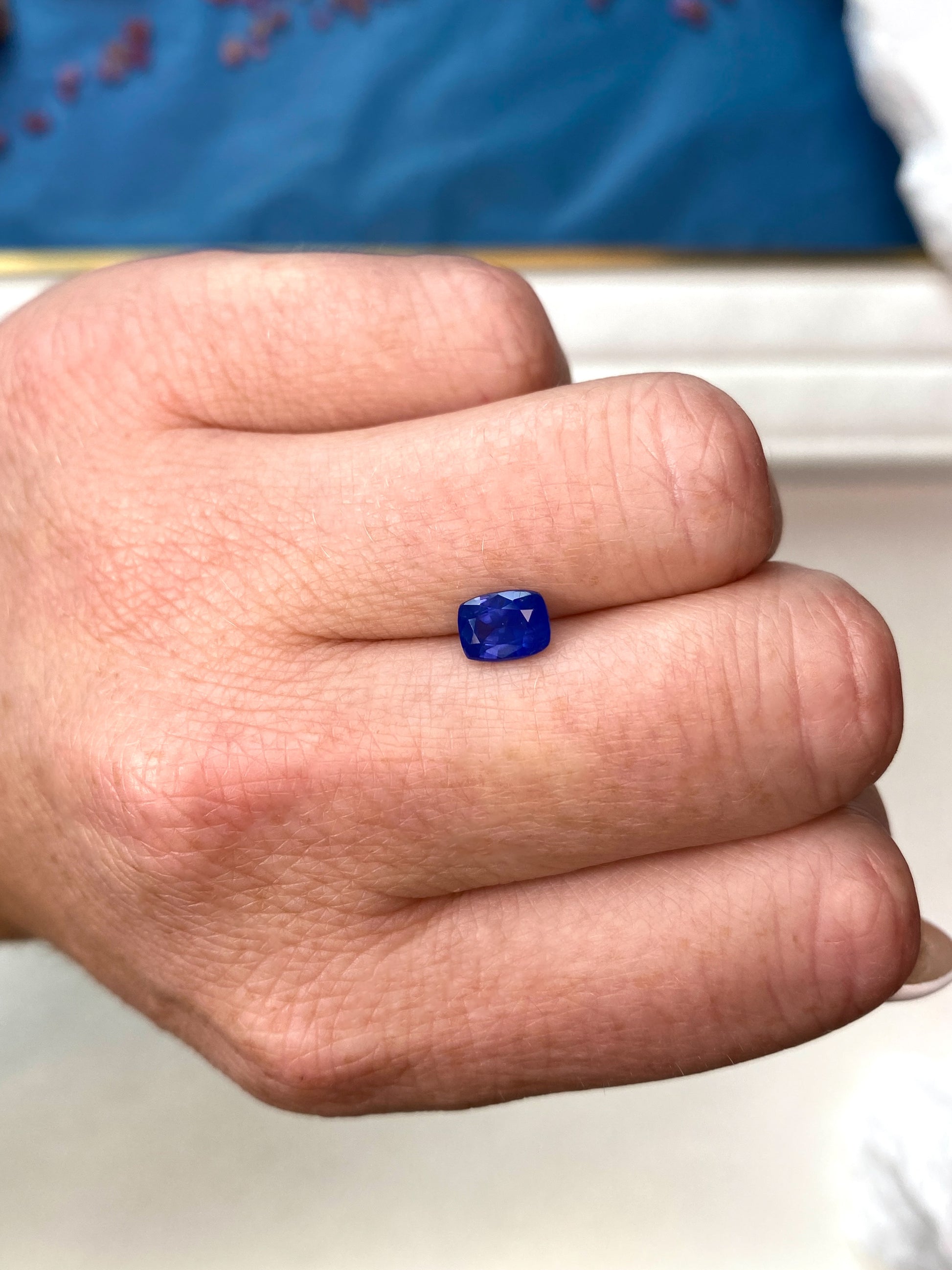 1.33ct Smokey Blue Sapphire Cushion Cut On Hand