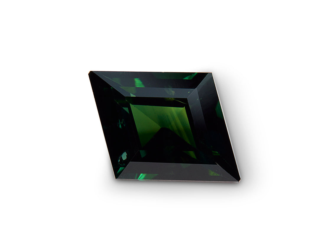 Square-cut sapphire with greenish color on a white background