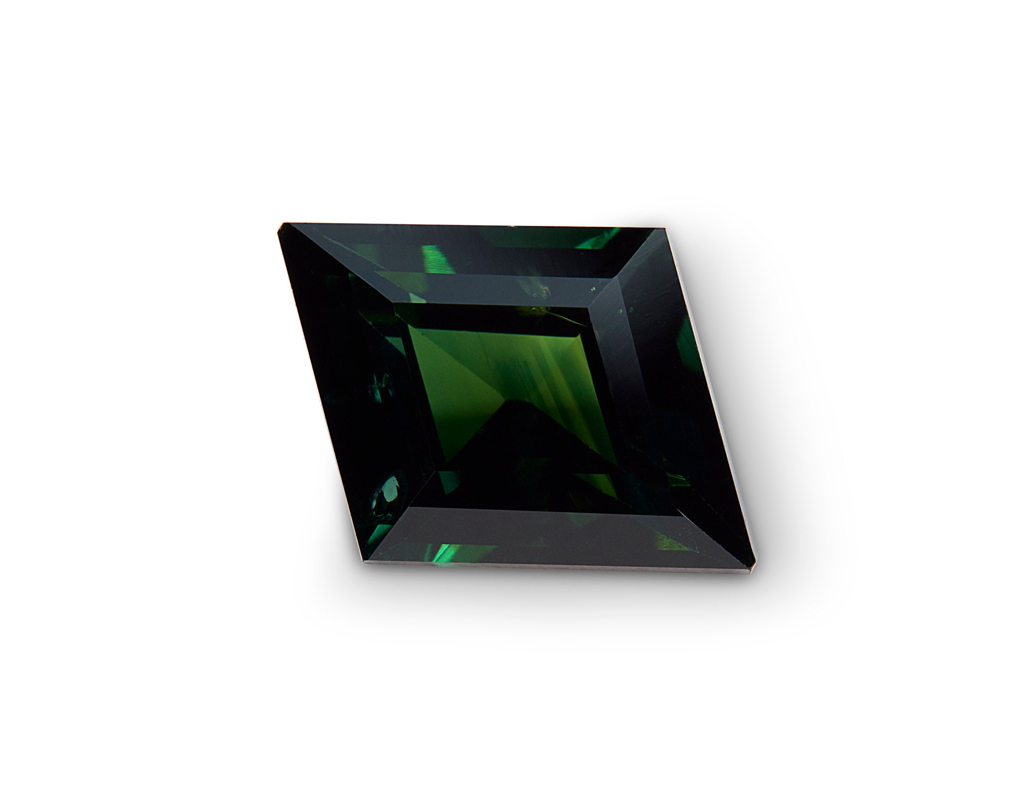 Square-cut green sapphire on a white background