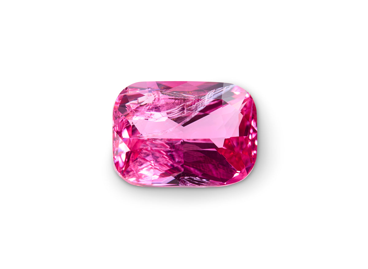 2.01ct Mahenge Spinel Cushion Cut on a white background to show clarity.