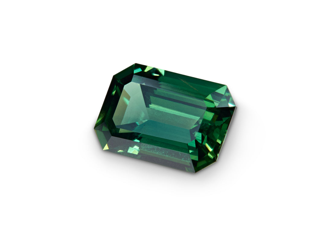 2.01ct Green Australian Sapphire Emerald cut on a white background to show clarity.