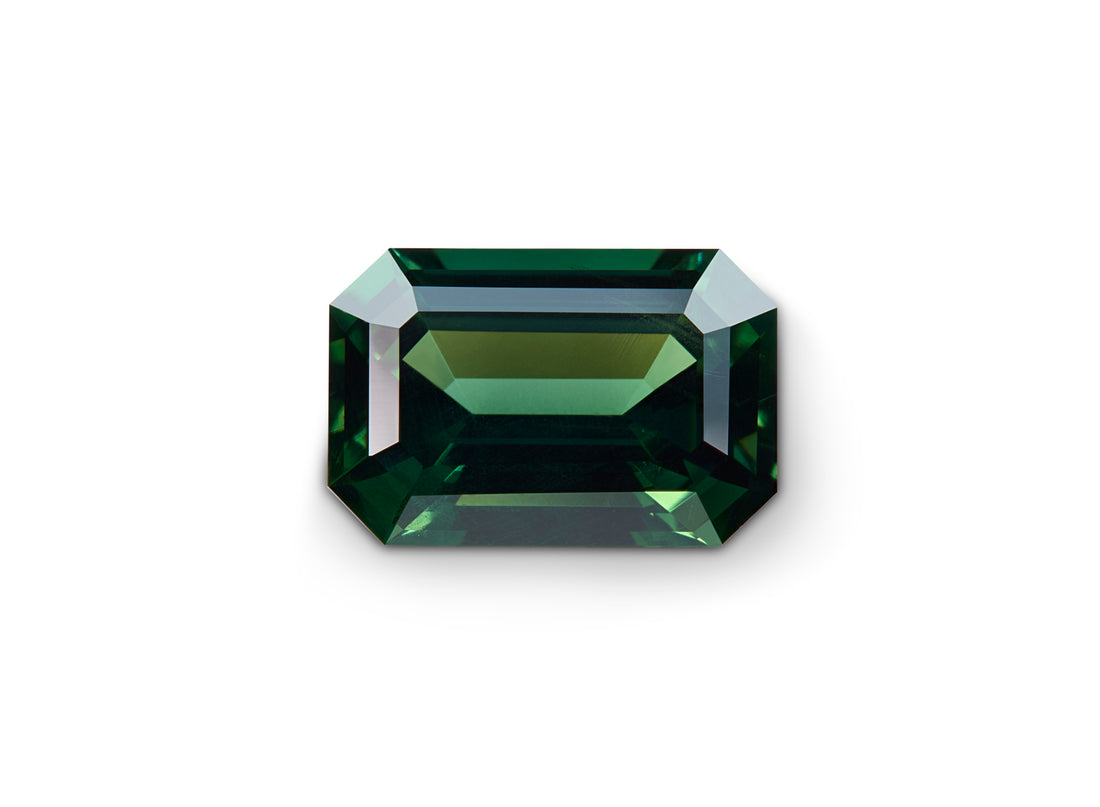 2.01ct Green Australian Sapphire Emerald cut on a white background to show clarity.