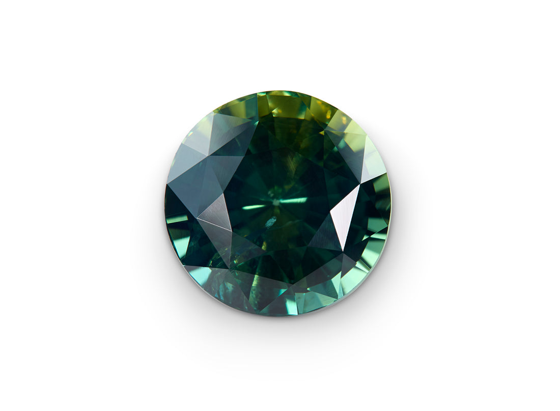 5.01ct Part Sapphire, Round Brilliant Cut on white background to show scale.